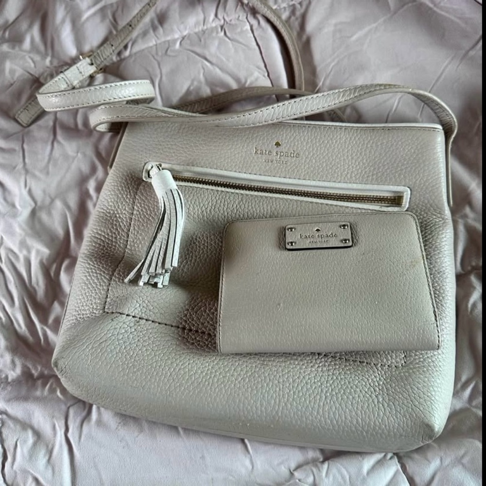 Kate Spade White Leather Crossbody Bag with matching wallet.